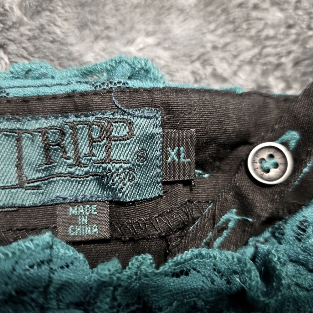 This is a XL tripp teal green and black corset